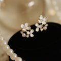 White Flower Clip on Earrings